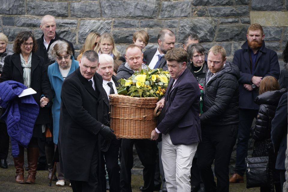 The coffins of Una Bowden and her daughters, Ciara and Saoirse, are carried from St Eunan’s Church in Raphoe after their funeral mass (Niall Carson/PA)