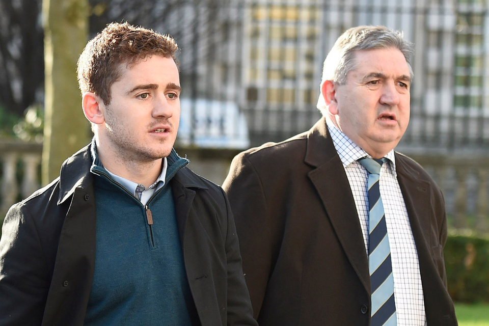 Ireland and Ulster rugby player Paddy Jackson (left) arrives at Belfast Crown Court. Photo: Michael Cooper/PA Wire