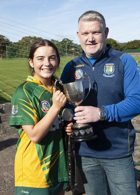 Knockananna captain Grace Mulhall receiving the cup from Wicklow Camogie Chairperson Ivor Lehane.  