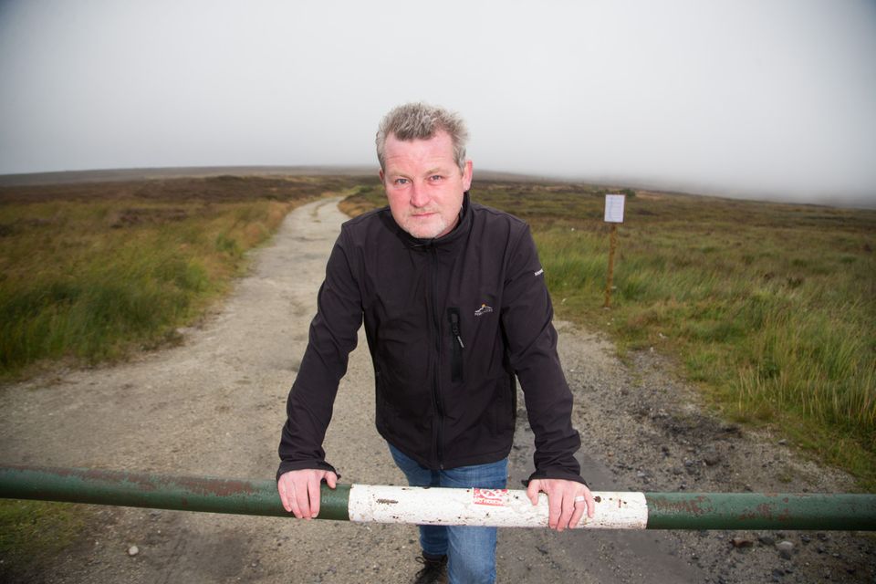 Making a difference: Ian Davis of the PURE Project in the Dublin/Wicklow mountains; and below, some of the illegal dumping. Picture by Mark Condren