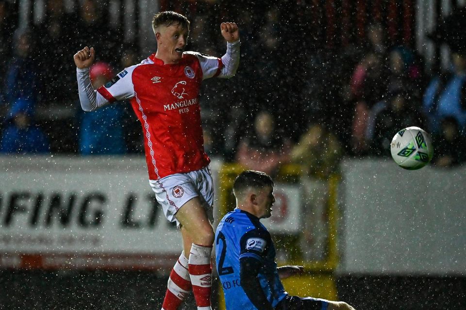 Chris Forrester scores of St Patrick's Athletic's second goal despite the attempted tackle of UCD's Michael Gallagher of UCD. Photo: Ben McShane/Sportsfile
