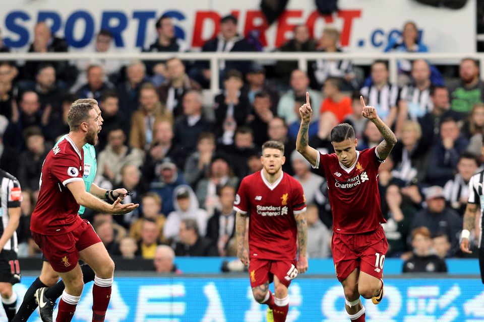 Philippe Coutinho celebrates scoring Liverpool's goal against Newcastle at St James' Park
