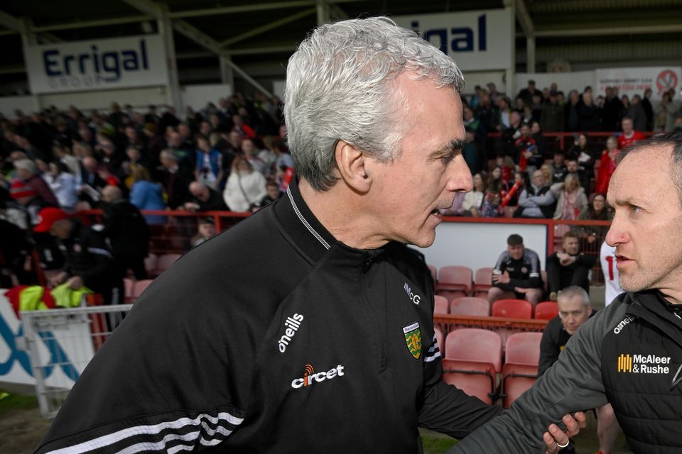 Jim McGuinness shakes hands with Brian Dooher after Donegal's win over Tyrone.