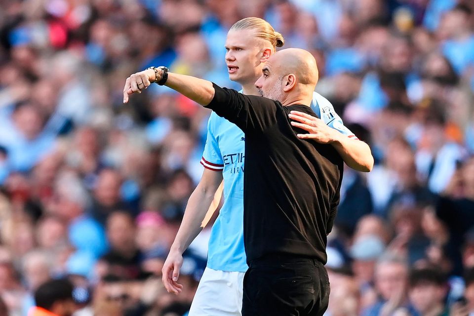 Erling Haaland of Manchester City speaks with his manager Pep Guardiola before coming off the bench against Chelsea at the weekend. Photo by Michael Regan/Getty Images