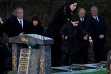 thumbnail: John Bruton’s grandson Oliver adds soil to the grave. Photo: Julien Behal