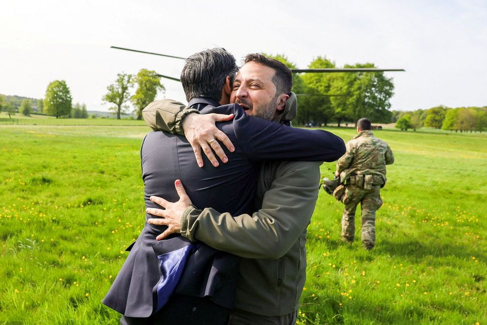 Britain's Prime Minister Rishi Sunak hugs Ukraine's President Volodymyr Zelenskiy in Aylesbury, Britain, May 15, 2023. Rishi Sunak via Twitter/Handout via REUTERS  