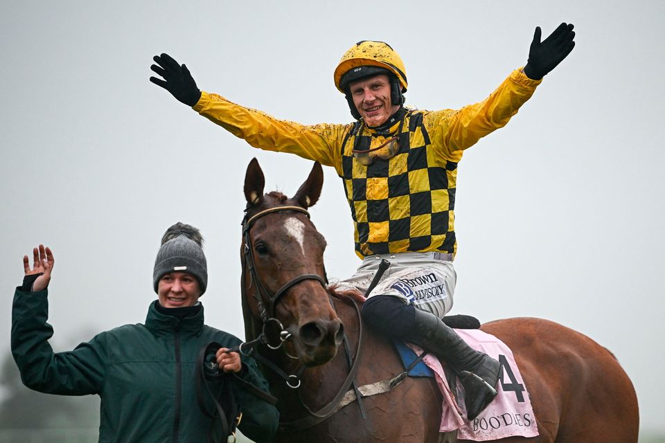 Paul Townend celebrates on State Man with groom Rachel Robbins after winning the Boodles Champion Hurdle during day four of the Punchestown Festival. Photo: Seb Daly/Sportsfile