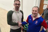 thumbnail: Arklow's Scott Young receiving his silver medal from the men's open doubles competition from tournament director Jimmy Gannon of Arklow Racquetball Club.  