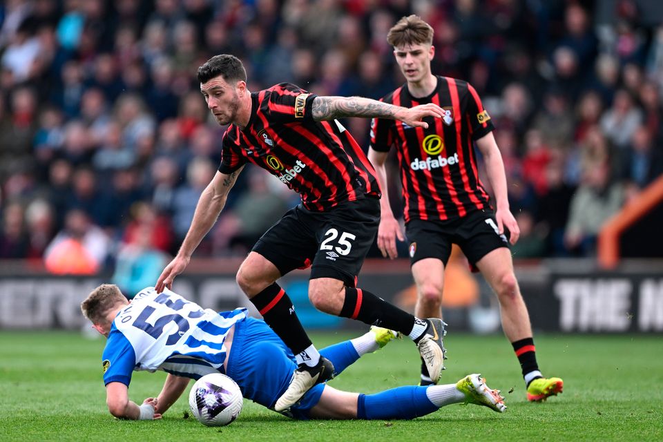Marcos Senesi is challenged by Mark O'Mahony at the Vitality Stadium. (Photo by Mike Hewitt/Getty Images)
