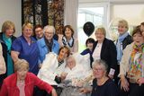 thumbnail: Sr. Rose Imelda (pictured centre) receiving a presentation to mark the 75th anniversary of her being 'professed' as a nun from friends and former work colleagues at the Fatima Nursing Home in Tralee where Rose is now a resident. 