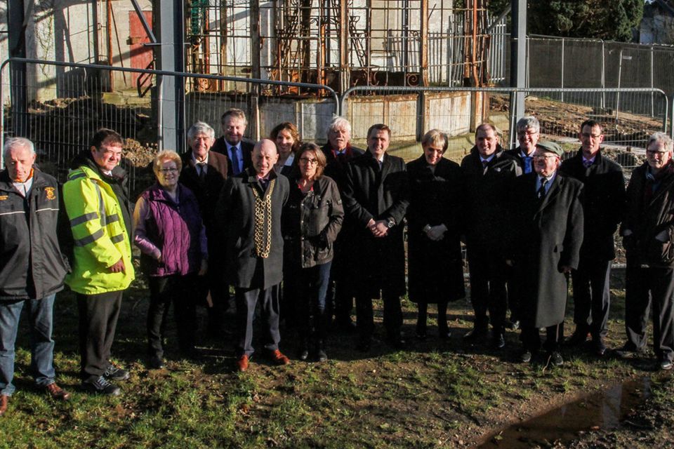 Minister Heather Humphreys, Minister Paul Kehoe, local councillors, council officials and committee members in front of the old conservatory at Castlebridge House