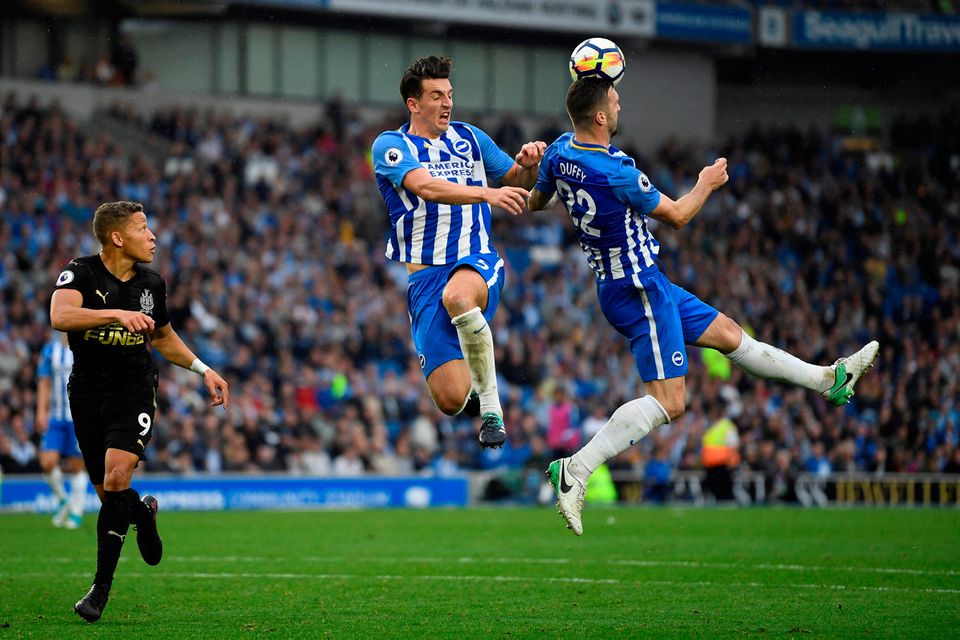 Shane Duffy and Lewis Dunk combine to clear any danger. Photo: Reuters/Tony O'Brien