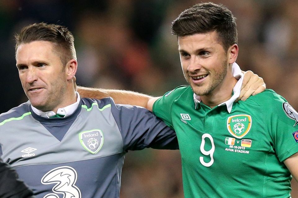 Republic of Ireland skipper Robbie Keane, left, congratulates match-winner Shane Long
