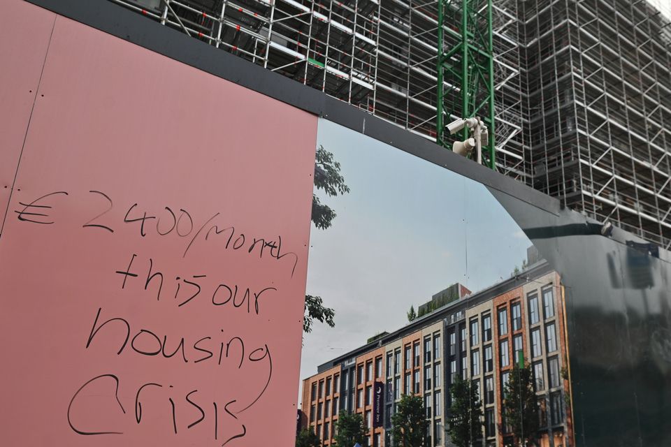 Graffiti on the fence of a construction site in Dublin this February as rents continue to increase in the capital