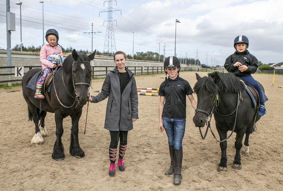 Luke Fox (7) and Lucy Coyne (8), both from Saggart, who are taking lessons with their helpers, Thomas Gibbons (14) and Mayla Van Den Berg, in the Fettercairn Youth Horse Project, pictued last September. The club were landed with an insurance premium of €42,000, up from only €5,500. Photo: Kyran O'Brien