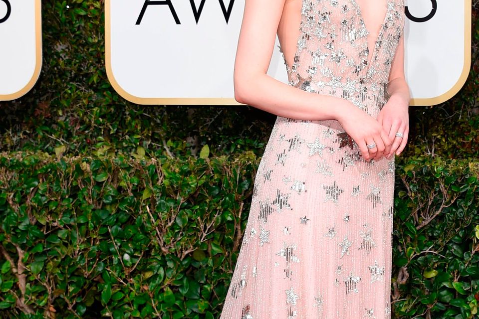 Actress Emma Stone arrives at the 74th annual Golden Globe Awards