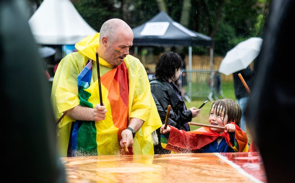 People brave the conditions as they take part in Dublin Pride events. Photo: Evan Treacy/PA Wire