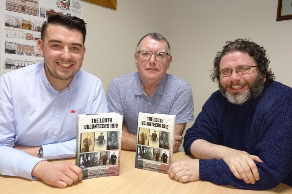 Padraic Agnew, Alan Bogan and Marcus Howard with their book