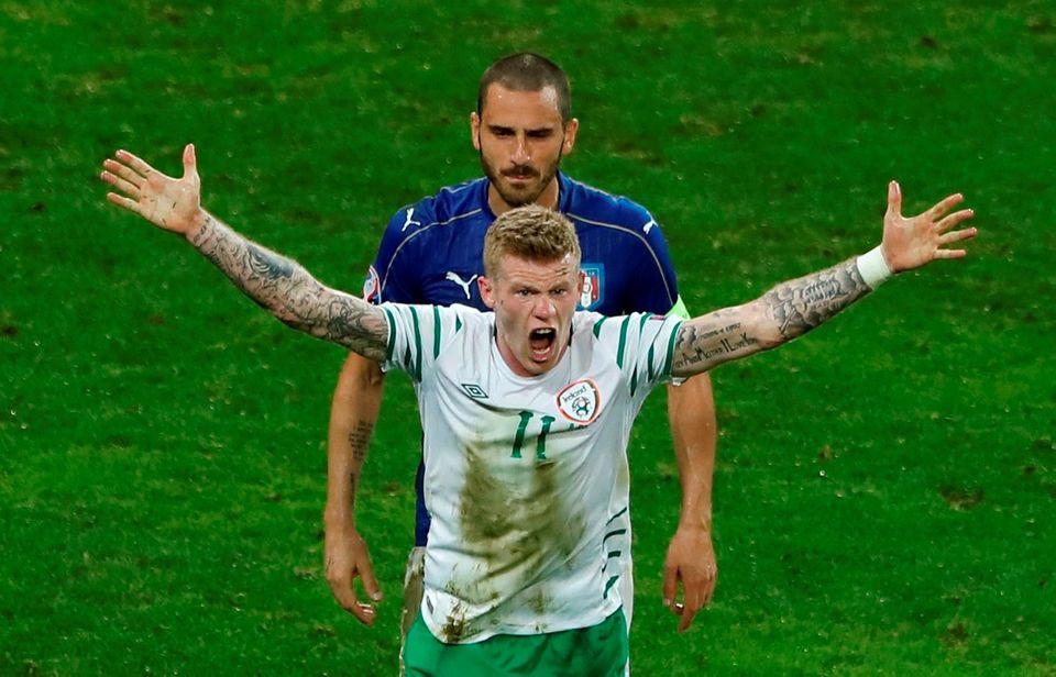 Republic of Ireland's James McClean gestures towards referee Ovidiu Hategan after being challenged by Italy's Federico Bernardeschi in the penalty area during Euro 2016