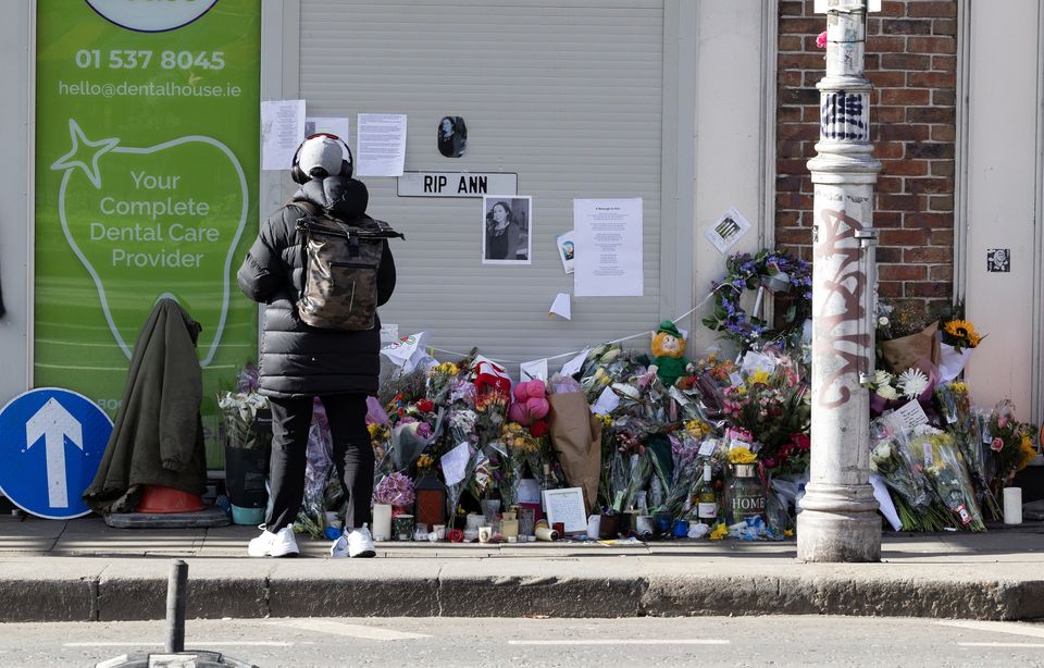 Flowers and candles left at the scene on Aungier Street where Ann Delaney regularly sat. Photo: Sam Boal/Collins