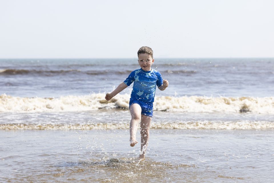 Cian (6) enjoying the sunshine on Dollymount Strand, Dublin. Photo SAM BOAL/Collins Photos
