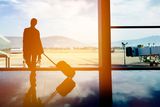thumbnail: A woman waits for her flight. Photo: Getty