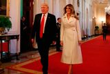 thumbnail: U.S. President Donald Trump and first lady Melania Trump walk into the East Room to attend an event celebrating Women's History Month, at the White House March 29, 2017 in Washington, DC.  (Photo by Mark Wilson/Getty Images)