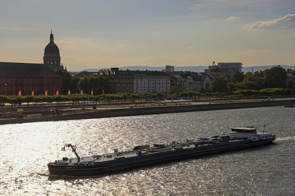 Oil tanker Calcit 12 sails on the Rhine River past Mainz, Germany. Photograph: Alex Kraus/Bloomberg