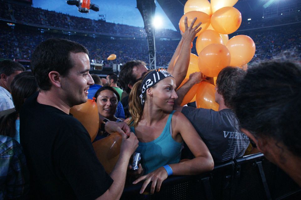 Fans of U2 watch them perform onstage on the first night of their 360 tour held at Camp Nou on June 30, 2009 in Barcelona. Photo: Getty Images