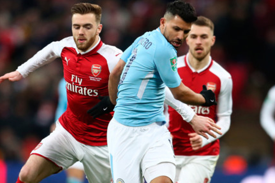 Giving chase: Arsenal’s Callum Chambers attempts to stop Manchester City’s Sergio Aguero during last Sunday’s League Cup final at Wembley