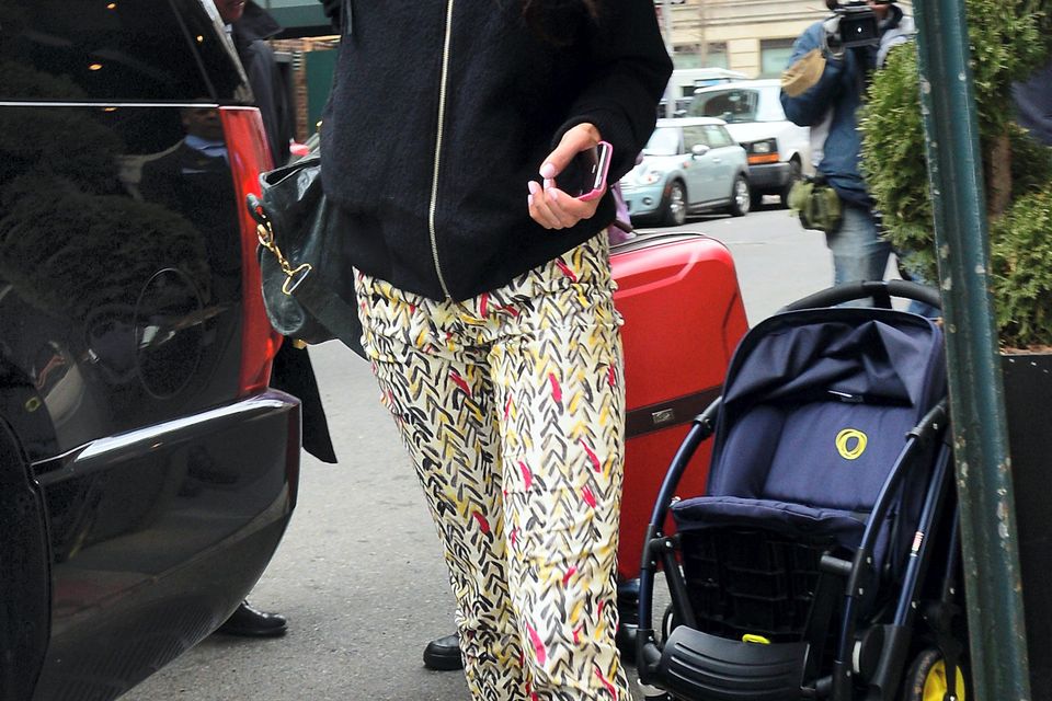 4: Amal in bomber jacket and printed pants in New York.