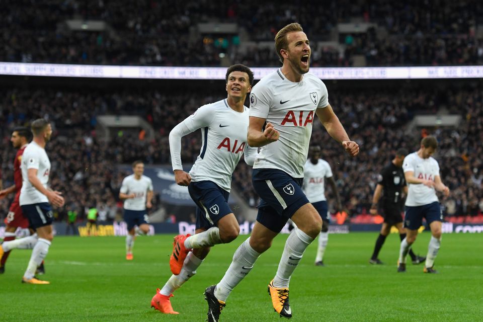 Harry Kane of Spurs (r) celebrates with Dele Ali after scoring the fourth goal and his second of the game during the Premier League match between Tottenham Hotspur and Liverpool at Wembley Stadium on October 22, 2017 in London, England.  (Photo by Stu Forster/Getty Images)