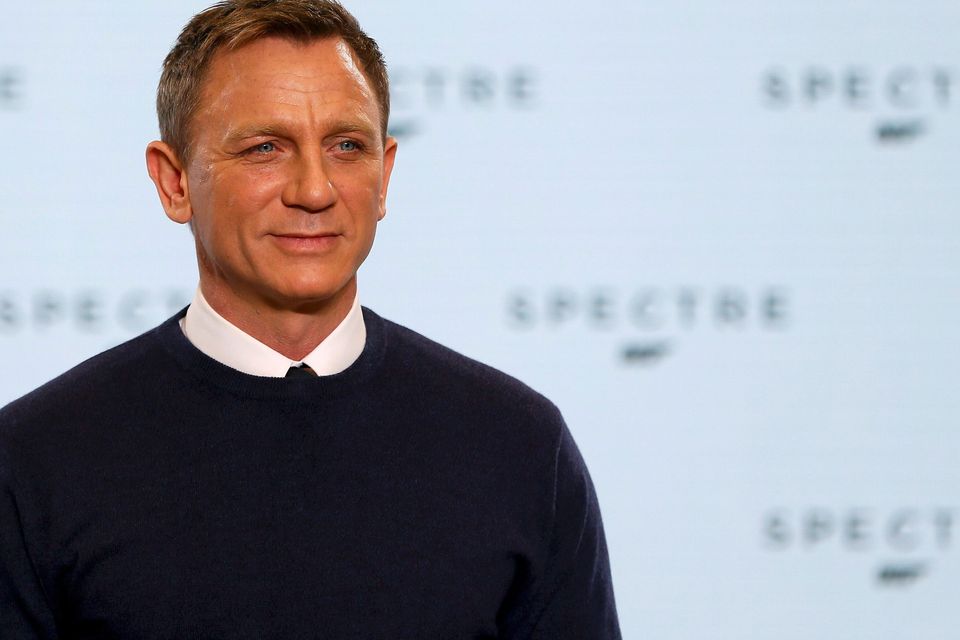 Actor Daniel Craig poses on stage during an event to mark the start of production for the new James Bond film "Spectre", at Pinewood Studios in Iver Heath, southern England December 4, 2014