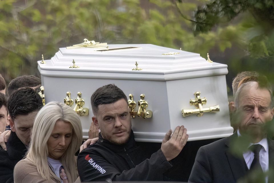 The remains of 21-year-old Rebecca Browne are carried to the church in Galliagh, Co Derry, for her funeral. Photo: NW Newspix