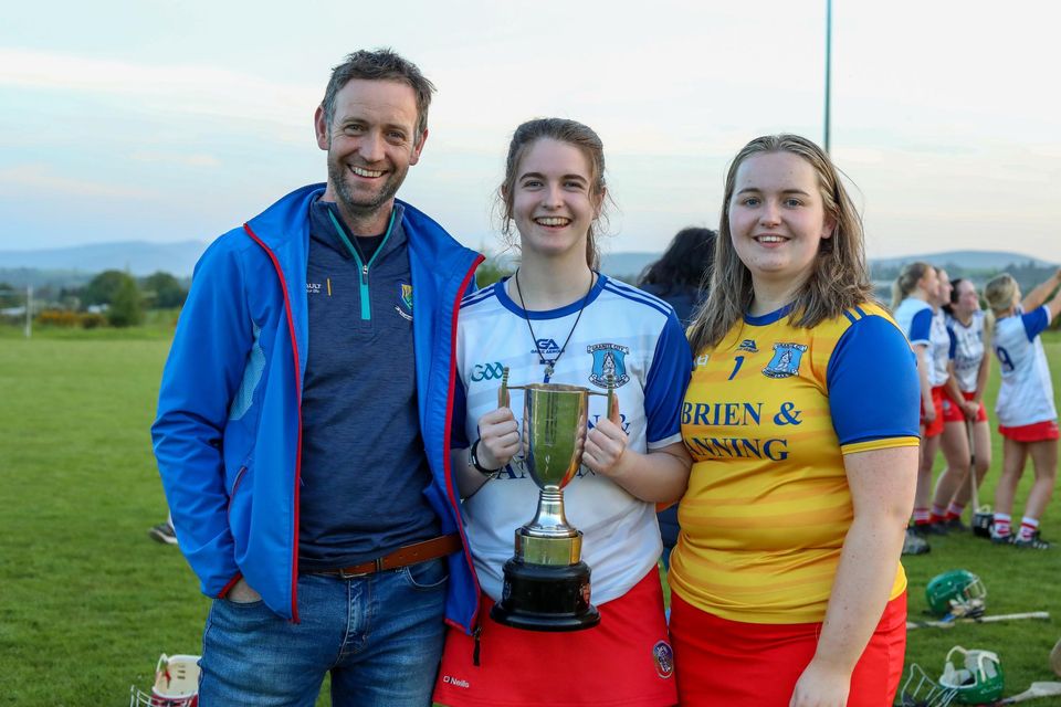 Proud Pops! Paul, Niamh and Ava Whelan celebrate with the cup.