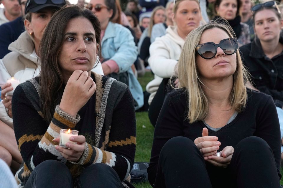 Mourners hold a candlelight vigil at Sydney's Bondi Beach to remember victims of the shopping mall knife attack. Photo: AP