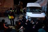 thumbnail: Protestors sitting down in front of van (with smashed windscreen) that tried to exit from site at Grangegorman lower, Dublin
