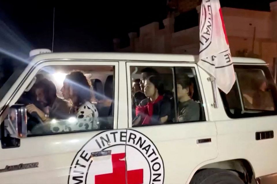 A vehicle carrying hostages abducted by Hamas militants during the October 7 attack on Israel arrives at the Rafah border, amid a hostages-prisoners swap deal between Hamas and Israel,  from the southern Gaza Strip November 24, 2023. REUTERS/Reuters TV