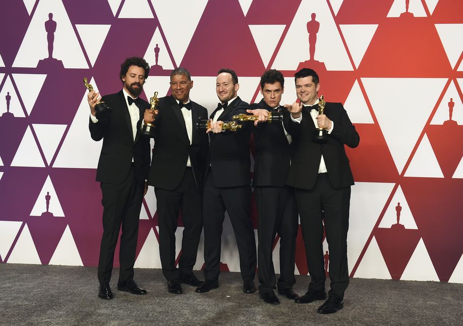 Bob Persichetti, from left, Peter Ramsey, Rodney Rothman, Phil Lord and Christopher Miller pose with the award for best animated feature film for Spider-Man: Into the Spider-Verse (Jordan Strauss/Invision/AP)