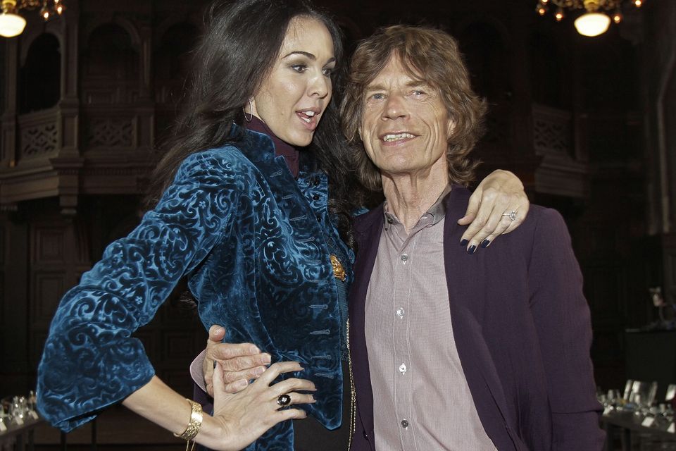 L'Wren Scott and Sir Mick Jagger, pictured in 2012 (AP)