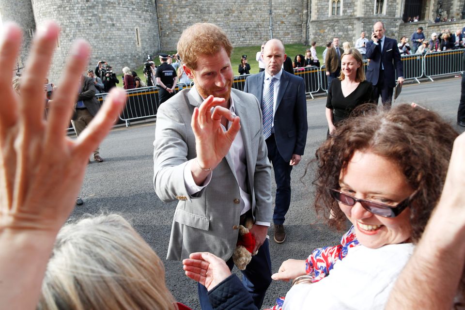 Britain's Prince Harry greets wellwishers outside Windsor Castle ahead of his wedding to Meghan Markle tomorrow, in Windsor, Britain, May 18, 2018. REUTERS/Damir Sagolj