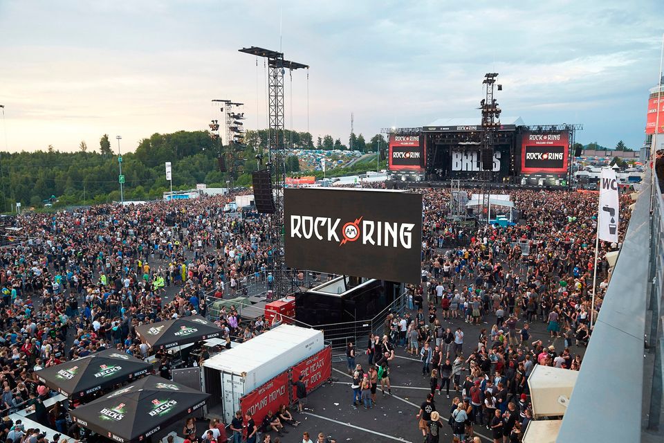 Visitors leave the music festival Rock am Ring outside the western town of Nuerburg, Germany, Friday, June 2, 2017. German authorities have shut down a popular rock music festival because of a possible terrorist threat. (Thomas Frey/Dpa via AP)
