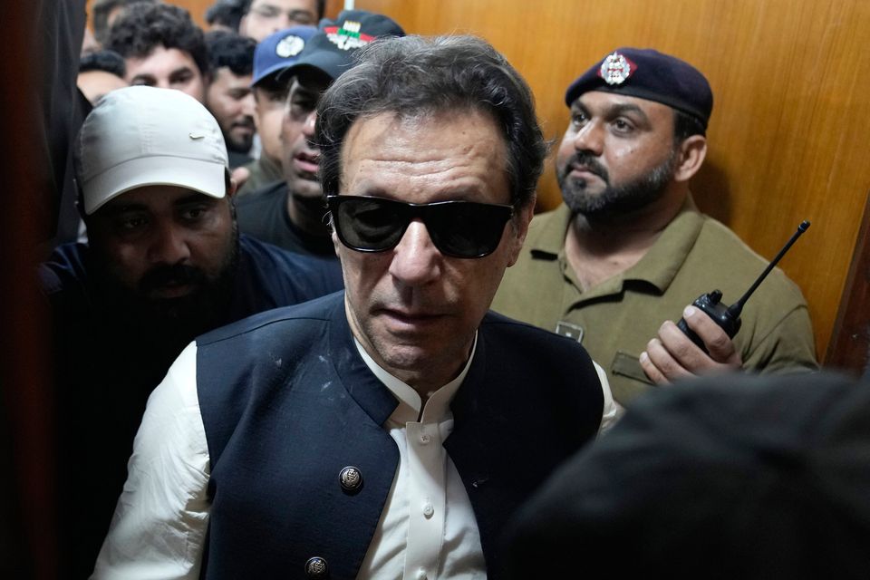 Former Pakistani prime minister Imran Khan leaves after appearing in a court, in Lahore, Pakistan, yesterday. Photo: KM Chaudary/AP
