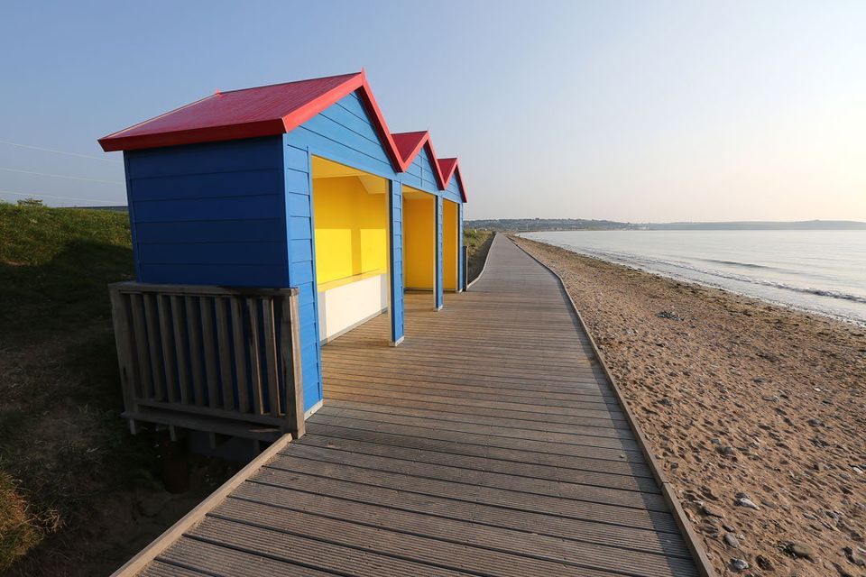 Beach huts or shelters at Youghal Beach, Co Cork, which offer shelter to swimmers and beach goers. Wexford sea swimmers are seeking something similar at Curracloe.