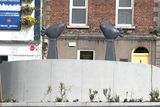 thumbnail: Get Tweeting! The birds chatter over the controversial wall at St Peter's Hill, Drogheda.