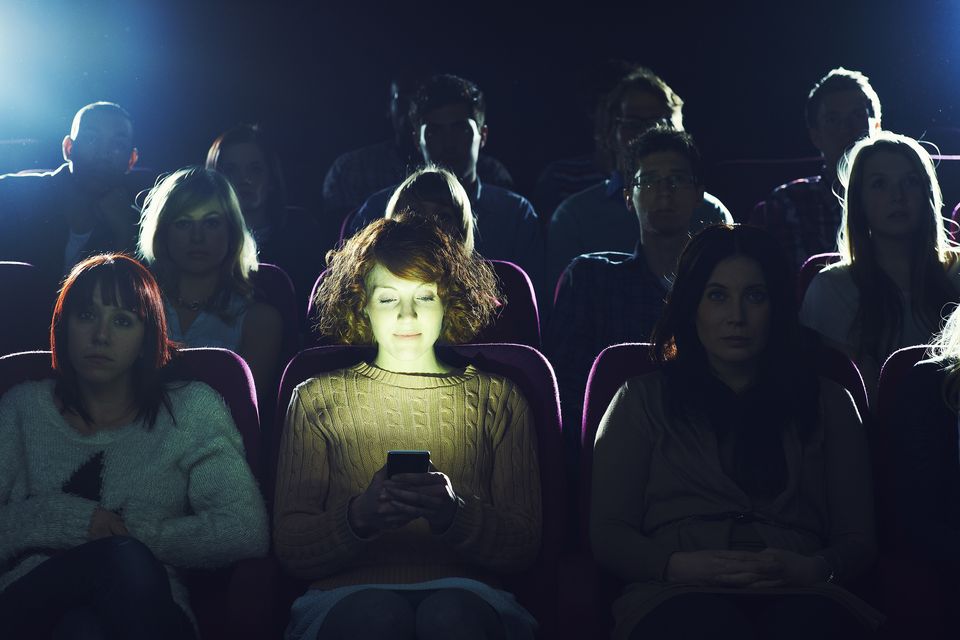 Looking at your smartphone is one of the cardinal sins of cinema-goers. Photo: Getty