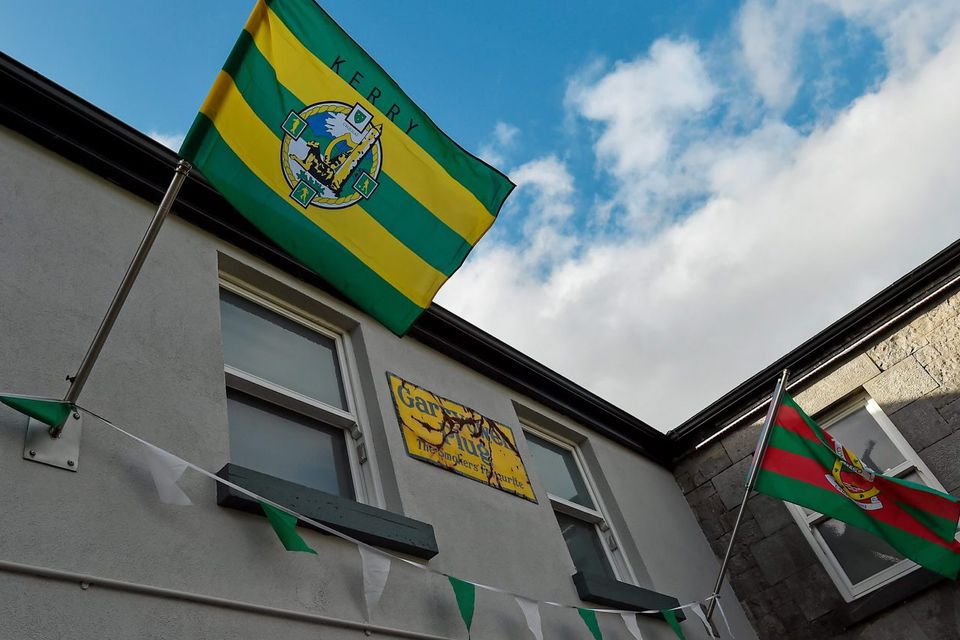 Kerry and Mayo flags fly outside the Ardhú Bar on the Ennis Road, Limerick ahead of the Semi-Final Replay