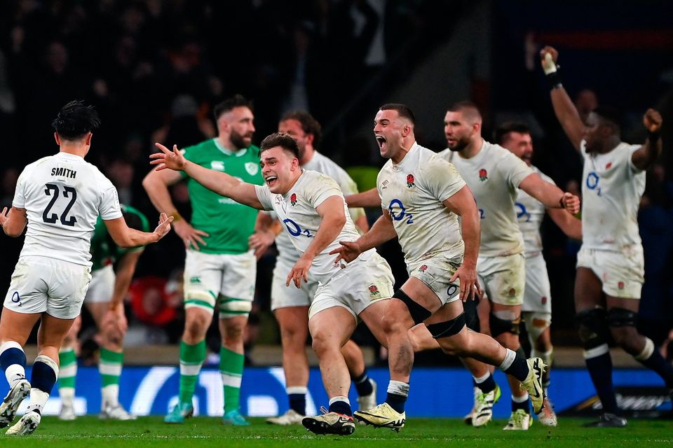 Theo Dan, centre, and Marcus Smith of England celebrate at the final whistle