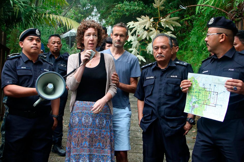 Meabh Quoirin thanks search teams looking for her daughter as dad Sebastien and police look on. Picture: AFP/Getty