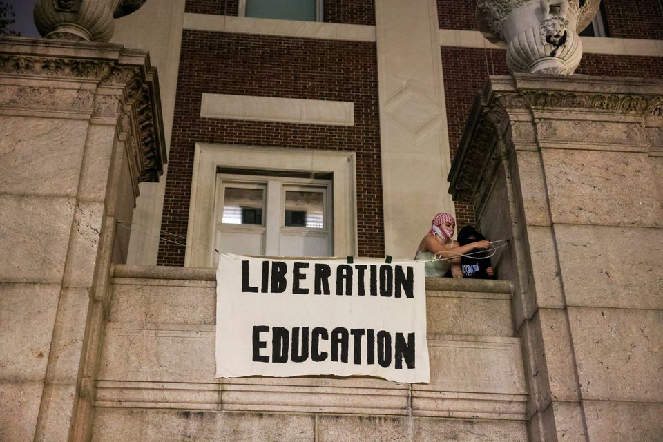 Protesters hang banners on the exterior of Hamilton Hall building after barricading themselves inside the building at Columbia University, after an earlier order from university officials to disband the protest encampment supporting Palestinians, or face suspension. Reuters